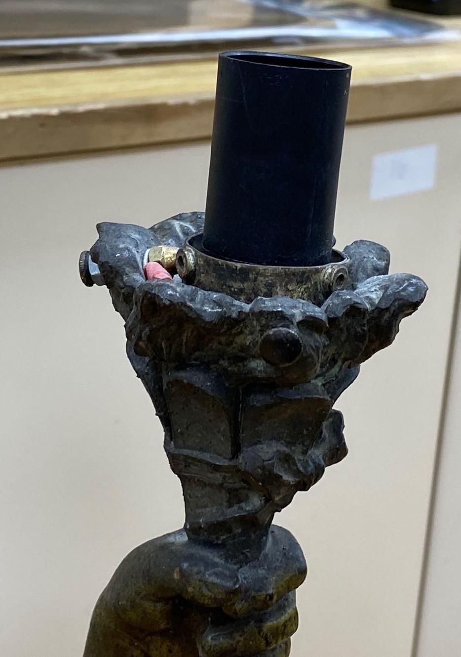 A bronzed finished lamp stem, Le Genie Humain, on rouge marble base, 90cm